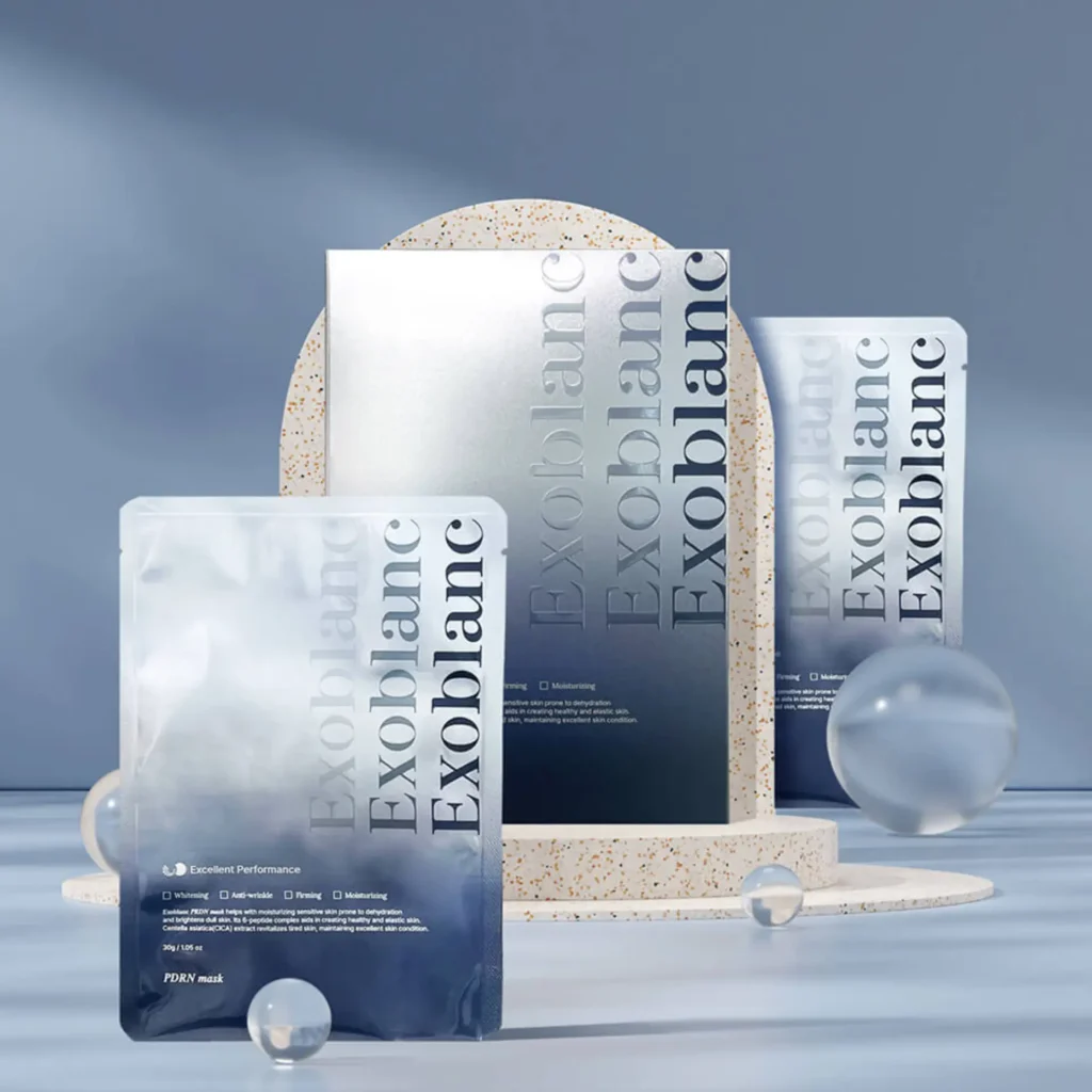 Exoblanc PDRN Mask sachets arranged on a blue backdrop